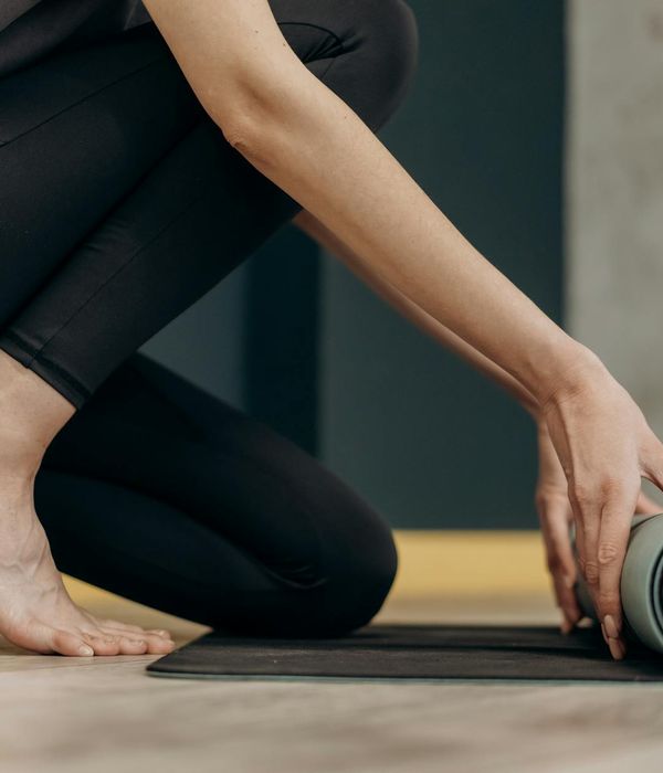 Person doing mindful eye relaxation exercise in a dark room